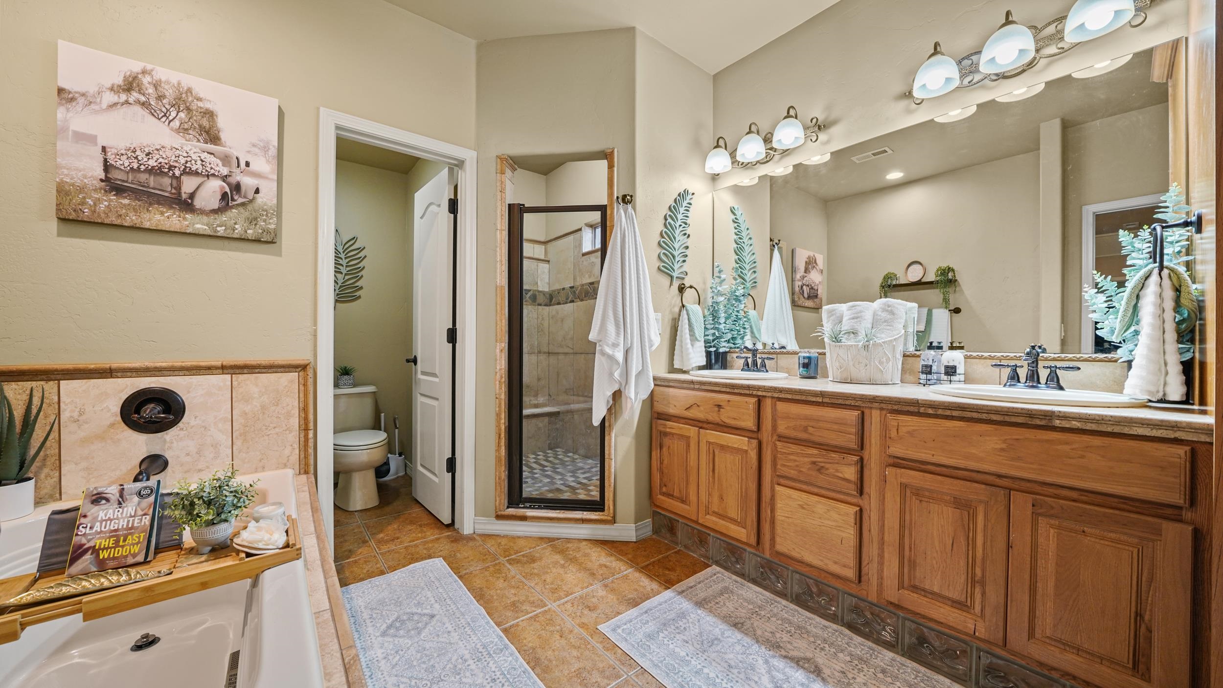 791 Yew Street Fruita, CO 81521 - Photo 19 of 33 a spacious bathroom with a double vanity sink mirror and shower