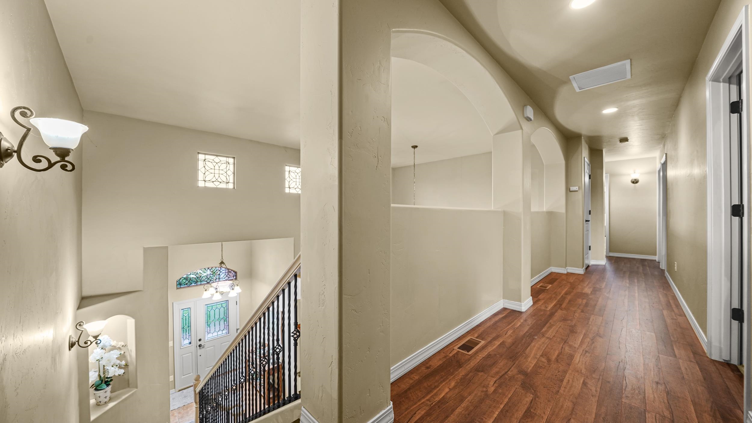 791 Yew Street Fruita, CO 81521 - Photo 22 of 33 a view of a hallway with wooden floor and staircase