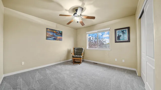 a view of a patio with a table and chairs