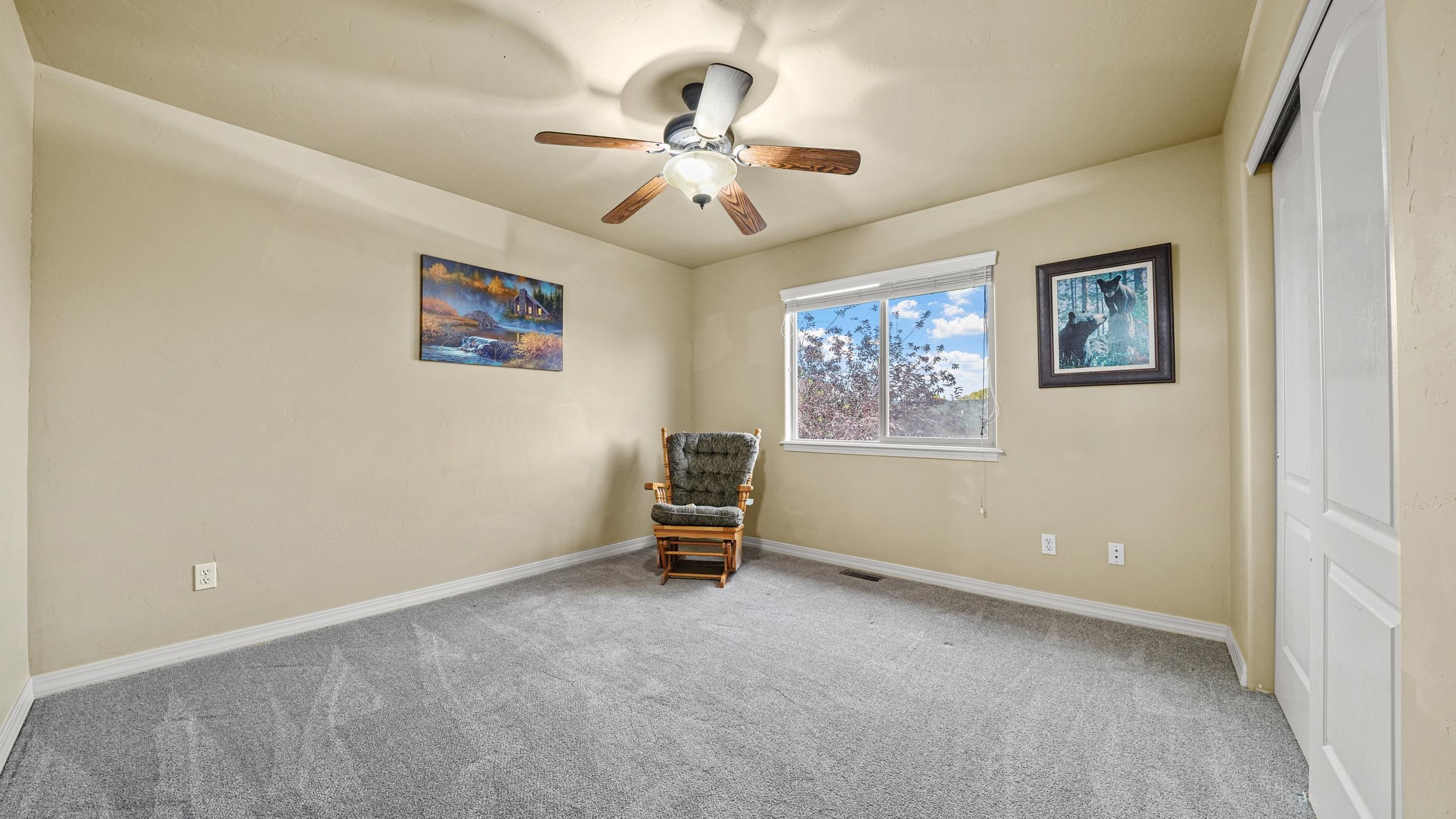 791 Yew Street Fruita, CO 81521 - Photo 26 of 33 an empty room with windows and fan
