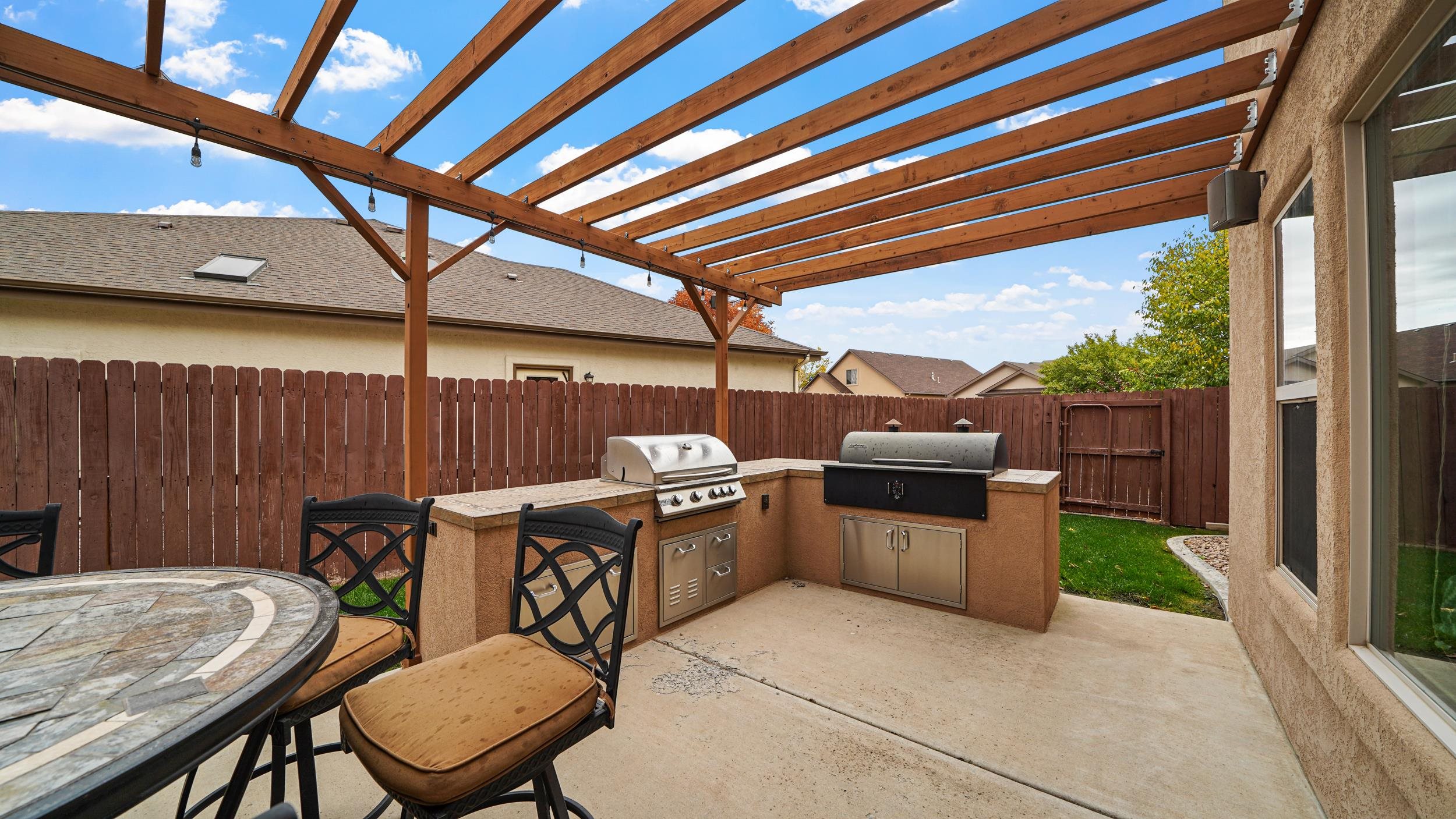 791 Yew Street Fruita, CO 81521 - Photo 27 of 33 a view of a patio with a table and chairs