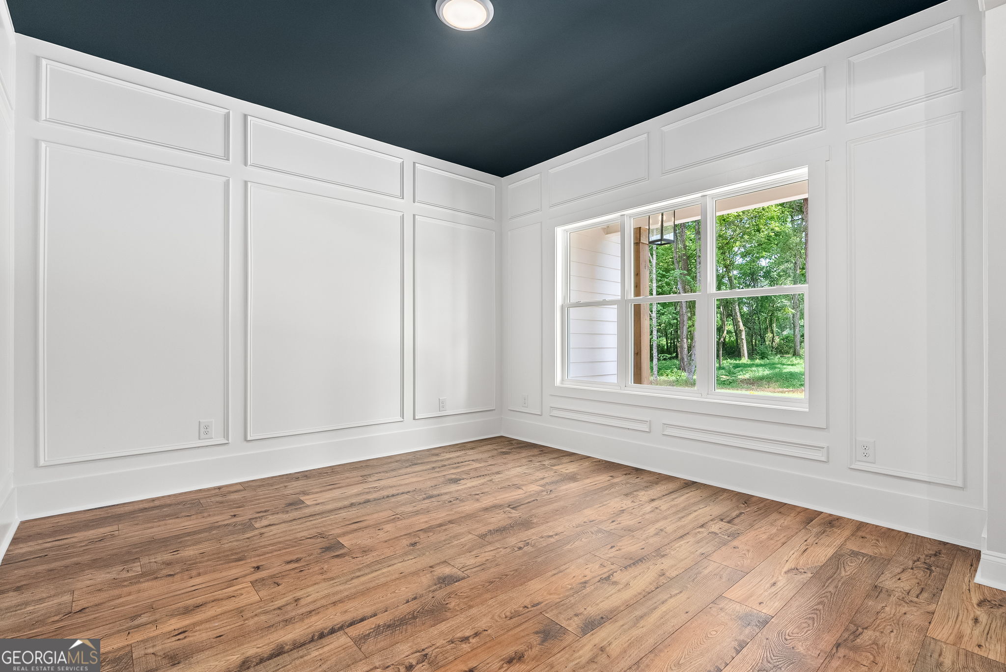 5021 Hammett Road Hogansville, GA 30230 - Photo 14 of 33 an empty room with wooden floor and windows