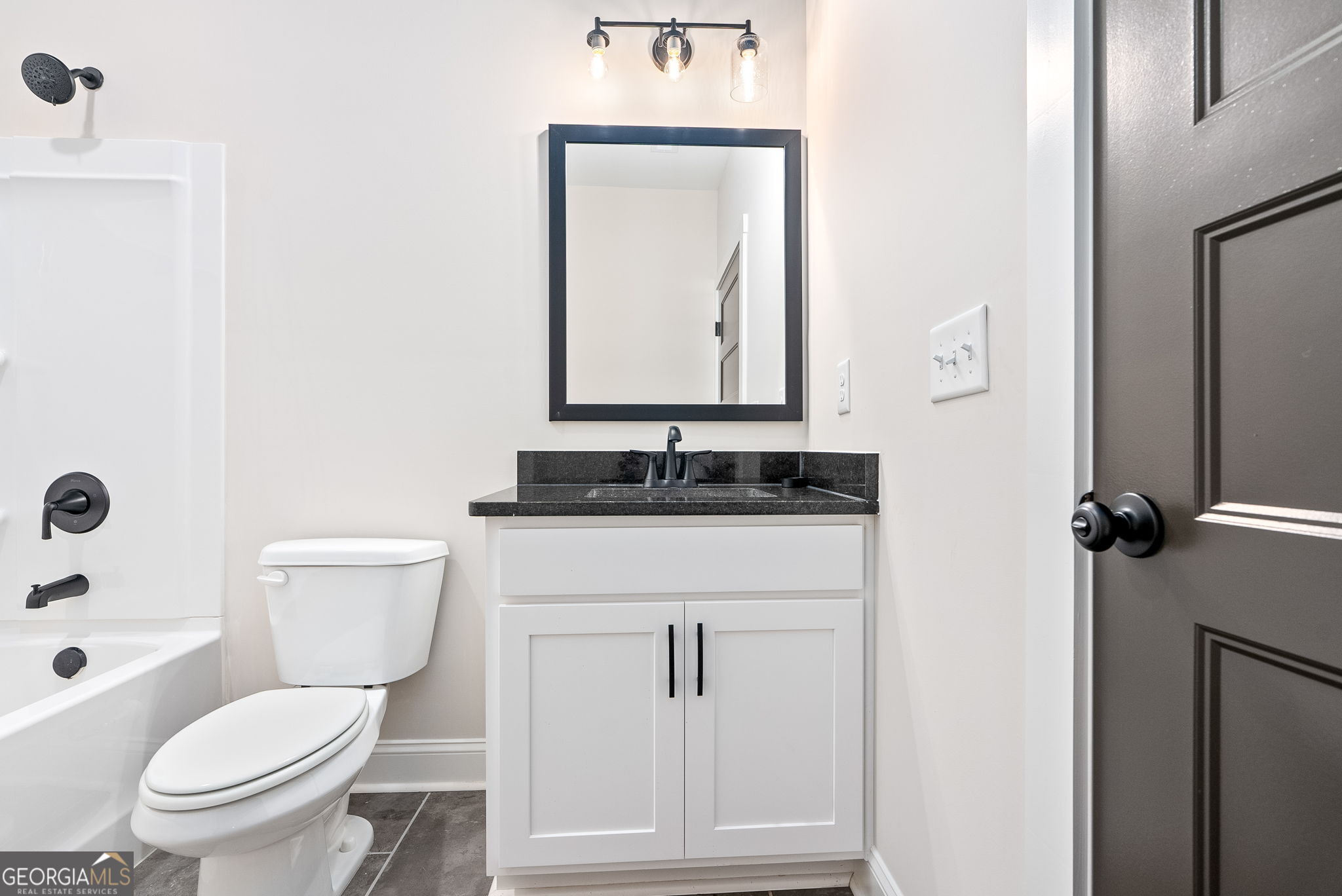 5021 Hammett Road Hogansville, GA 30230 - Photo 16 of 33 a bathroom with a toilet sink and mirror