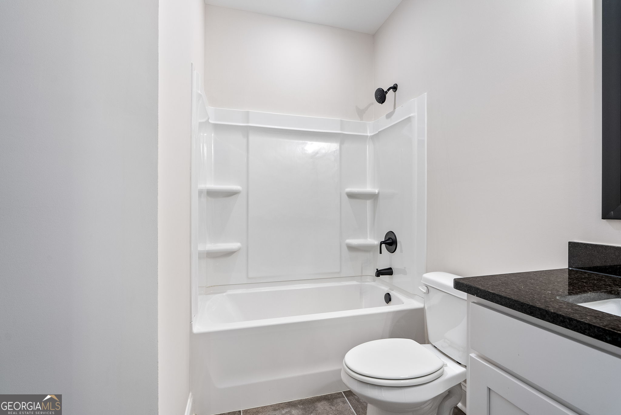 5021 Hammett Road Hogansville, GA 30230 - Photo 17 of 33 a bathroom with a bathtub and a toilet