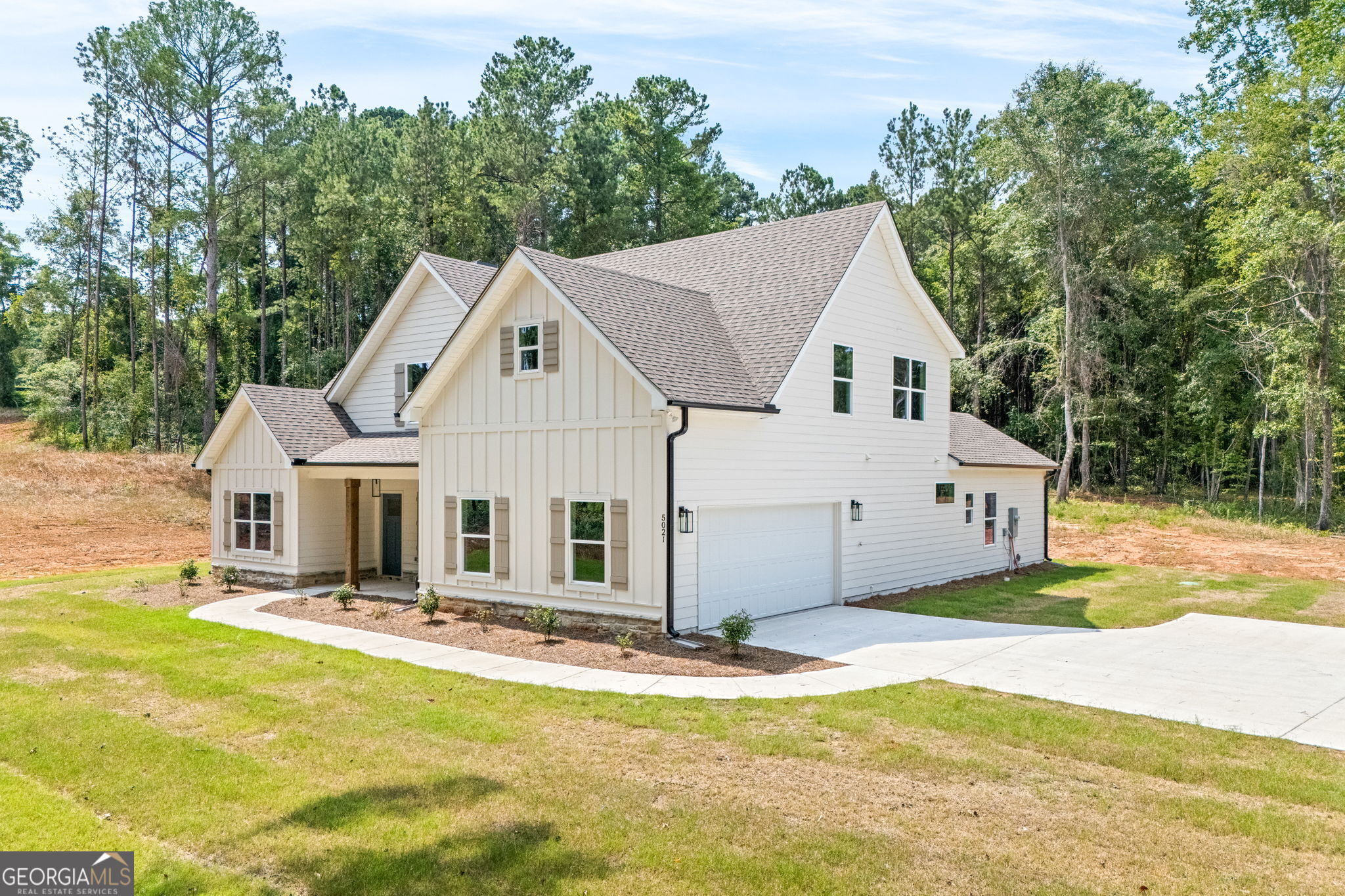 5021 Hammett Road Hogansville, GA 30230 - Photo 3 of 33 a front view of a house with a yard outdoor seating and garage