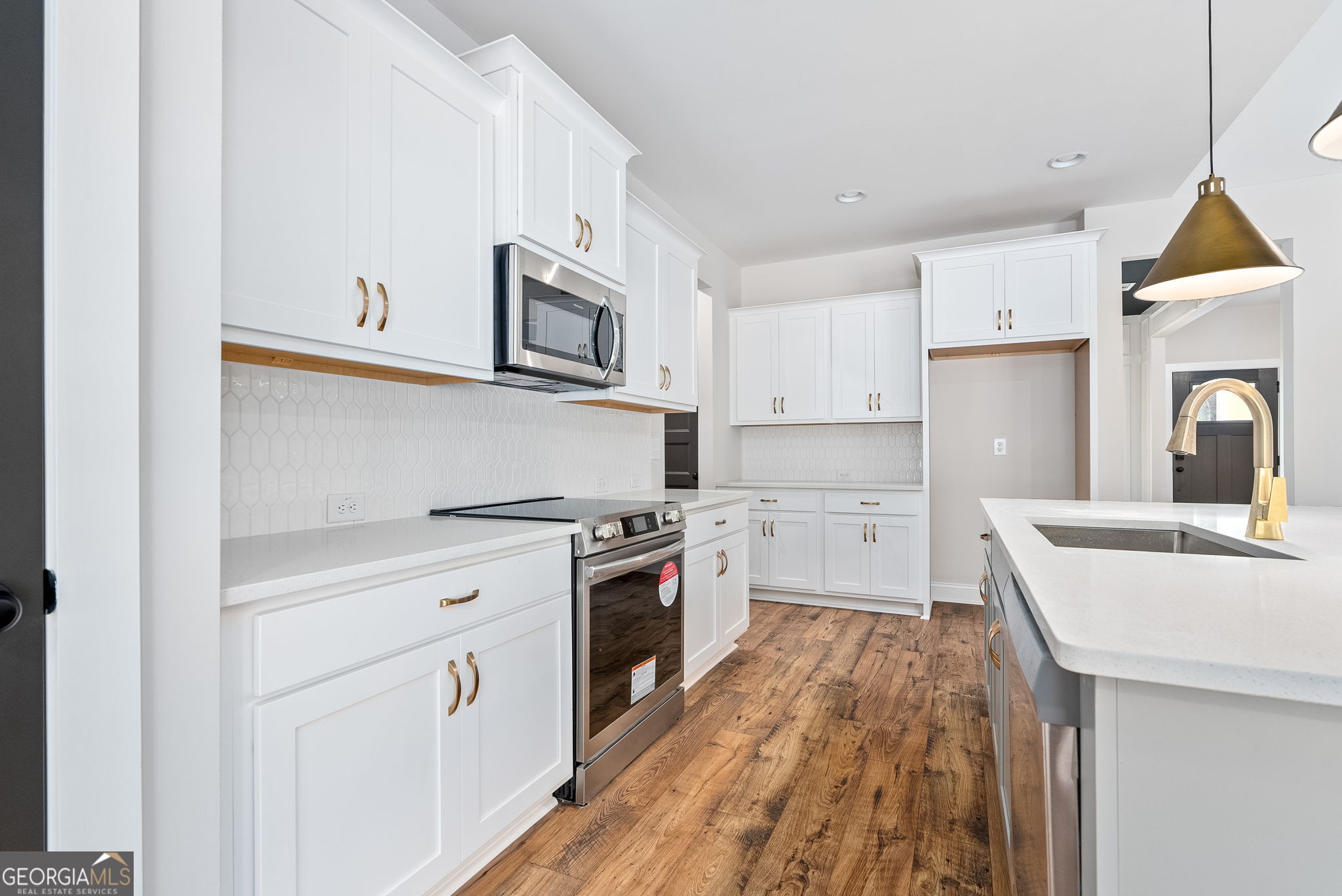 5021 Hammett Road Hogansville, GA 30230 - Photo 10 of 33 a kitchen with cabinets oven and a sink