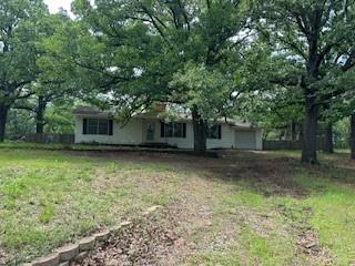 492 Richerson Road Denison, TX 75021 - Photo 1 of 29 a front view of a house with a garden