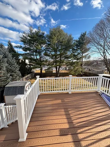 a view of a balcony with wooden floor