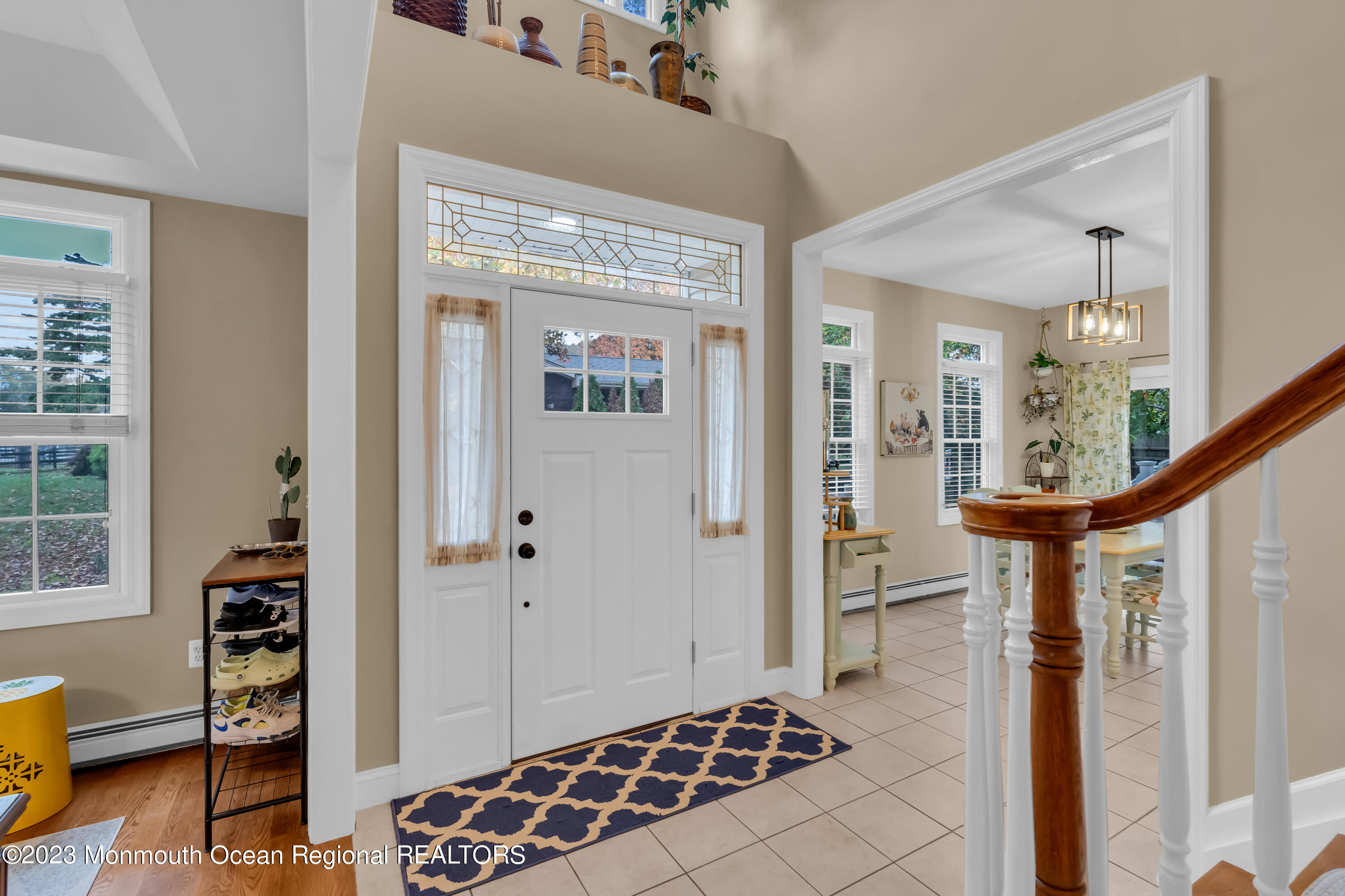 29 Muhlenbrink Road Colts Neck, NJ 07722 - Photo 6 of 36 a view of a hallway with wooden floor and furniture