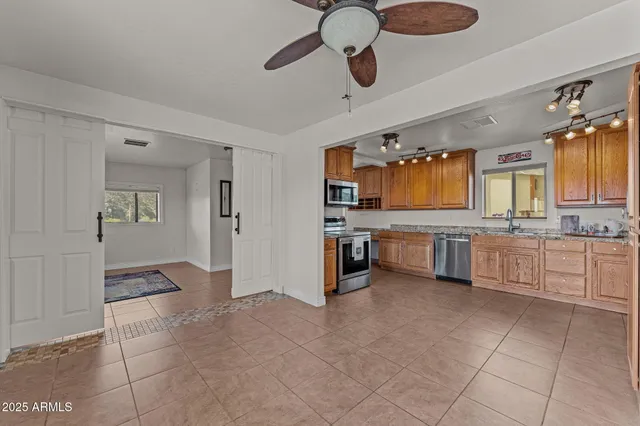 a view of a dresser and mirror in a room