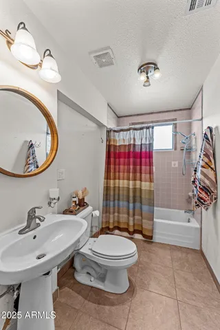 a bathroom with a sink a mirror and a window