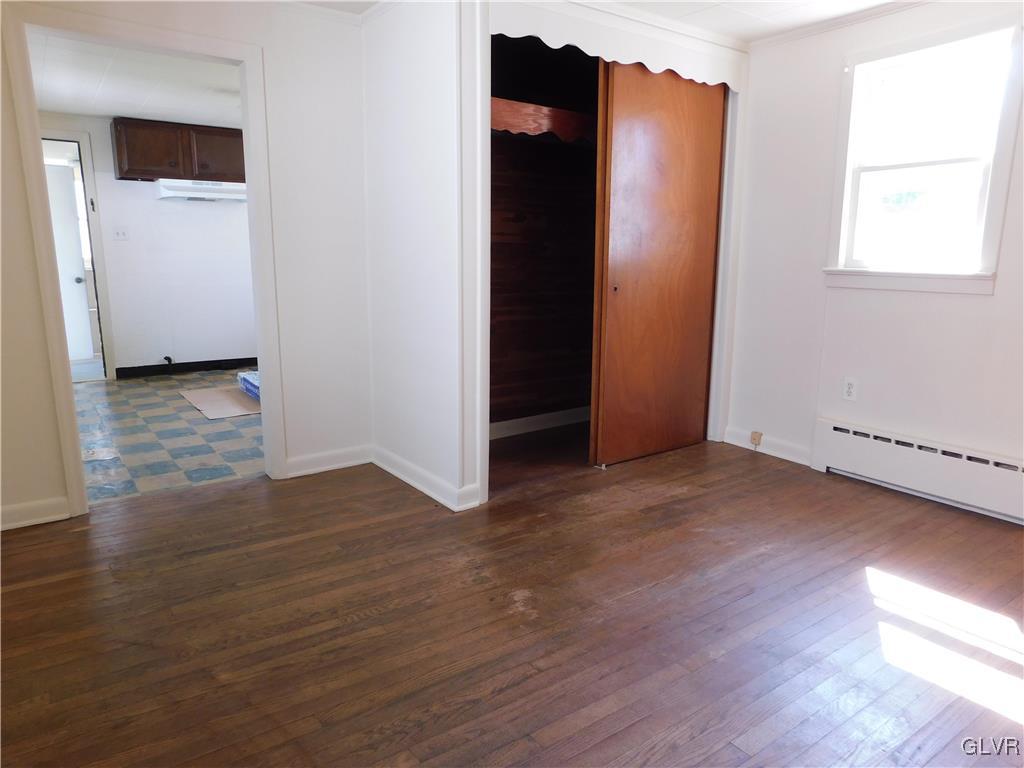 2808 Middletown Road Bethlehem, PA 18020 - Photo 13 of 40 an empty room with wooden floor and cabinet