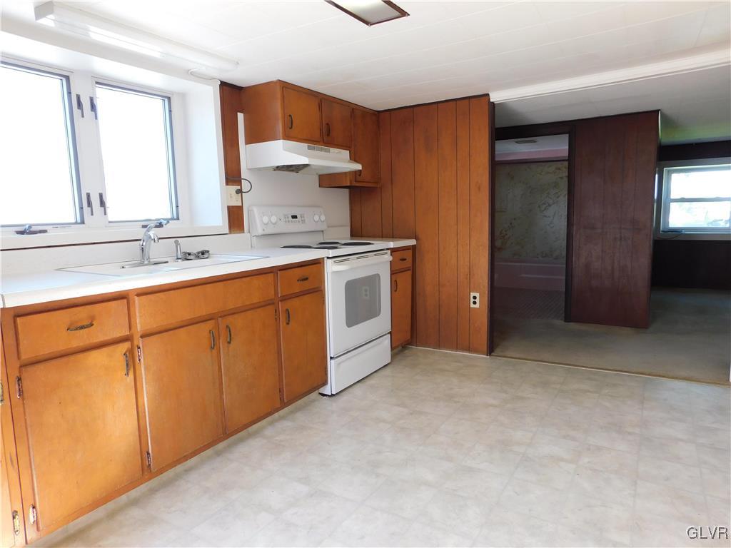 2808 Middletown Road Bethlehem, PA 18020 - Photo 29 of 40 a kitchen with a sink stove and cabinets