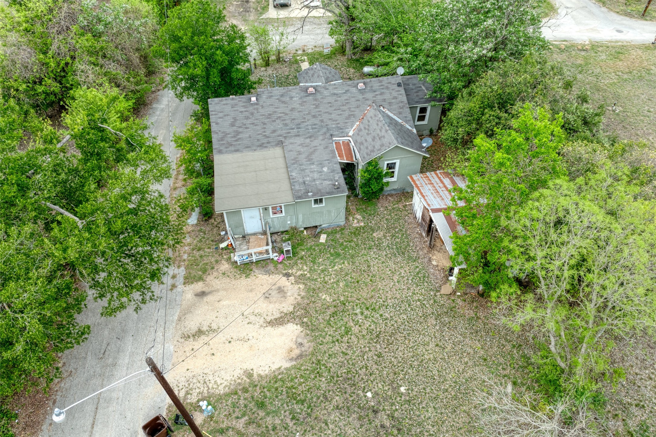 1006 Proctor Street Lockhart, TX 78644 - Photo 14 of 24 an aerial view of a house with a yard