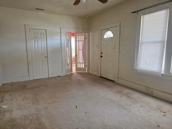 a view of an empty room with a window
