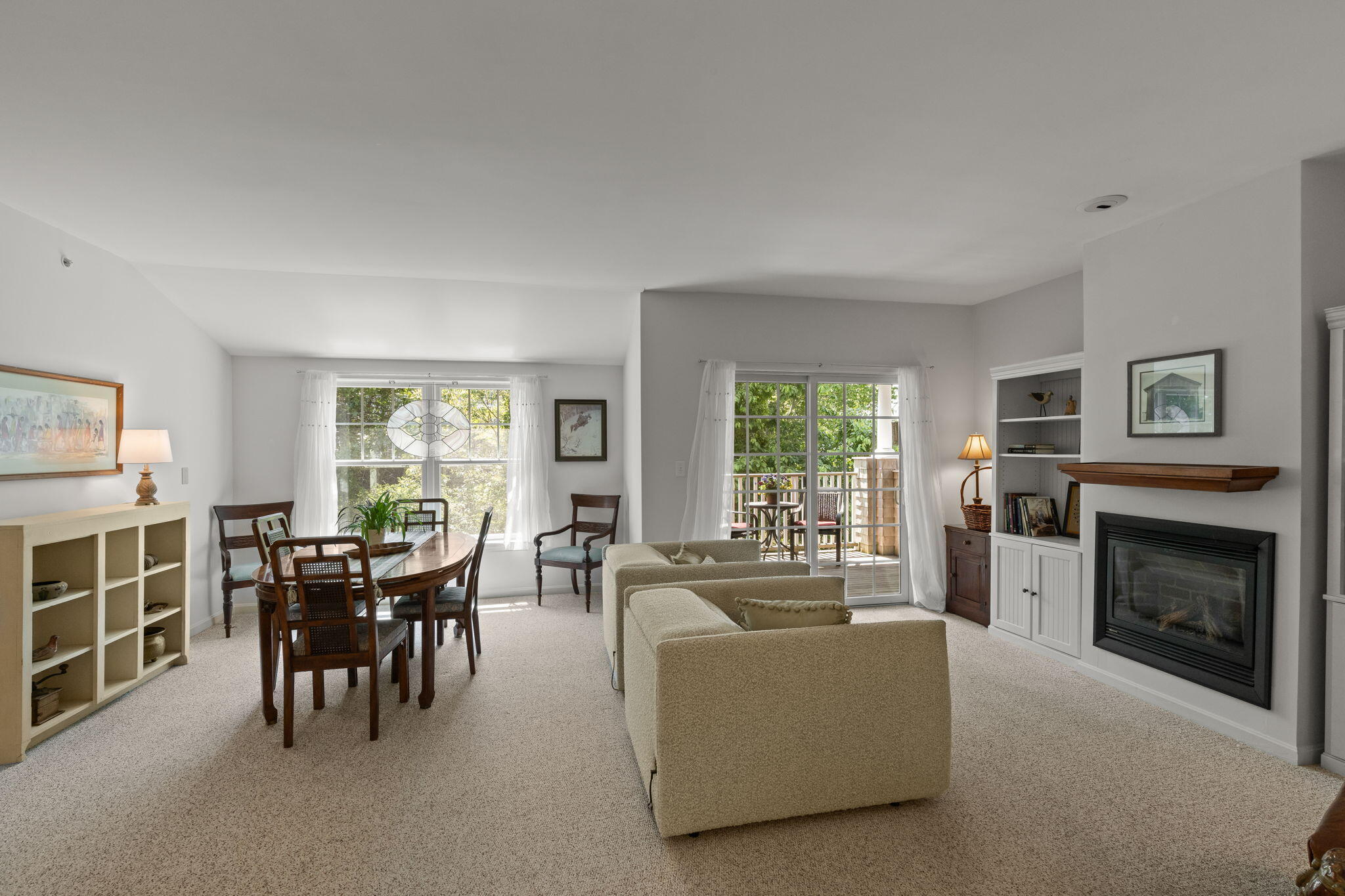 18 West Road, Unit 315 Orleans, MA 02653 - Photo 12 of 49 a living room with furniture a fireplace and a window
