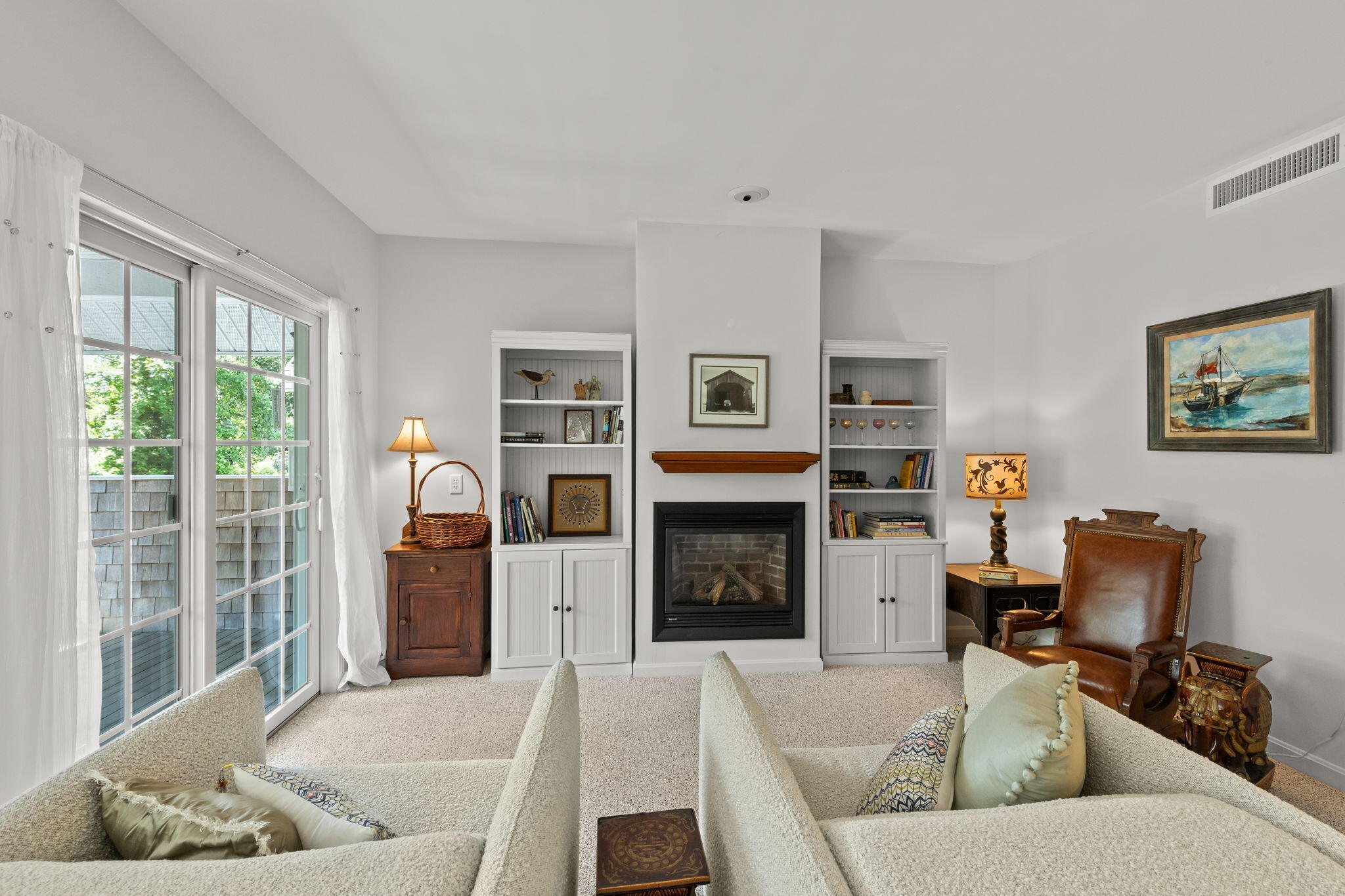18 West Road, Unit 315 Orleans, MA 02653 - Photo 14 of 49 a living room with furniture flat screen tv and a fireplace
