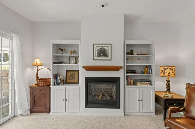 a work room with furniture and a fireplace