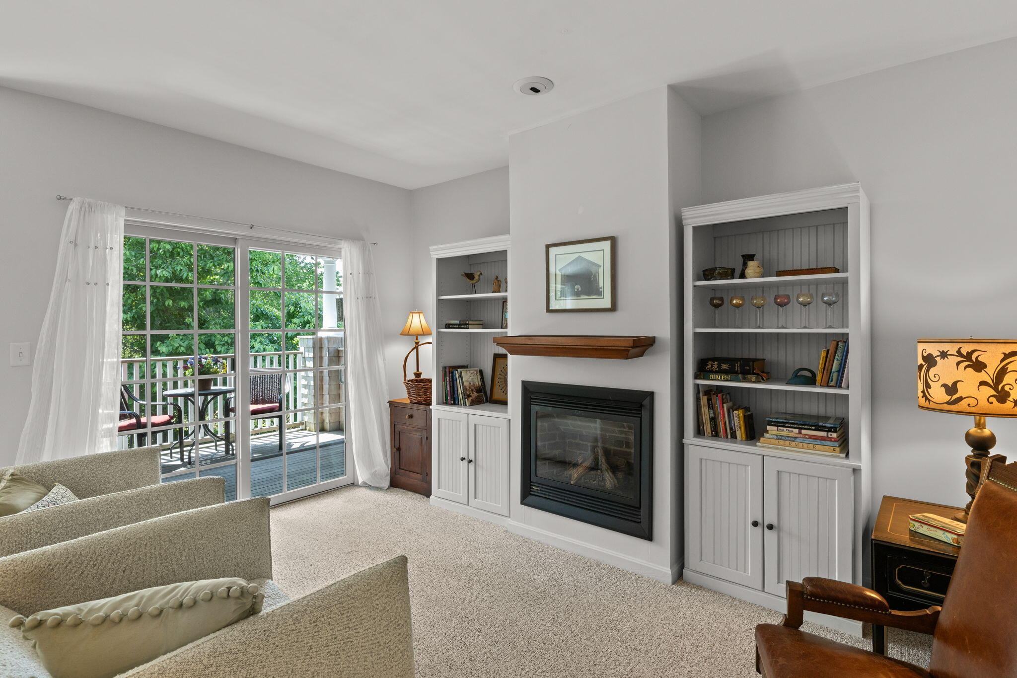 18 West Road, Unit 315 Orleans, MA 02653 - Photo 16 of 49 a living room with furniture and a fireplace