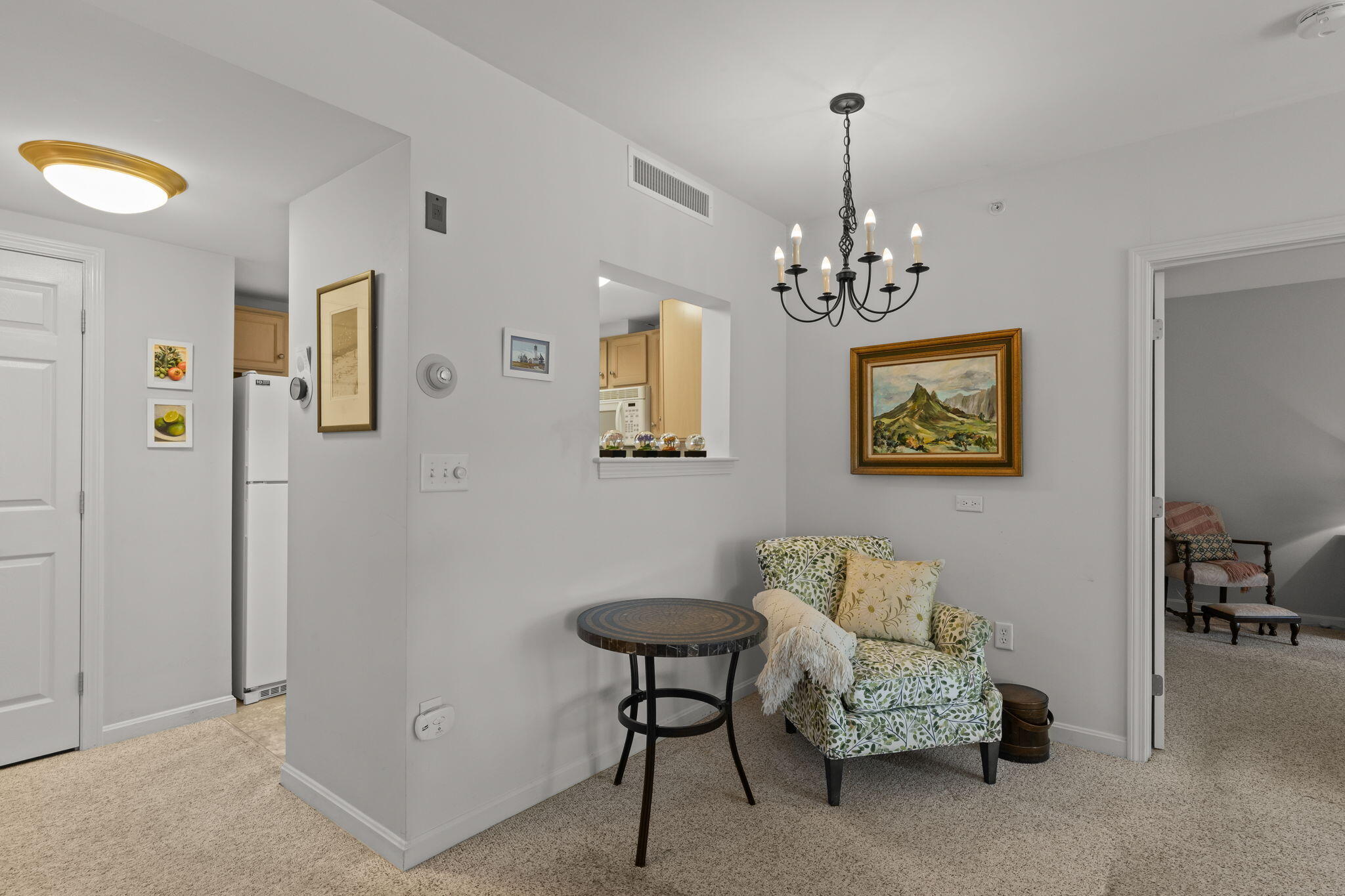 18 West Road, Unit 315 Orleans, MA 02653 - Photo 20 of 49 a view of a livingroom with furniture and a chandelier