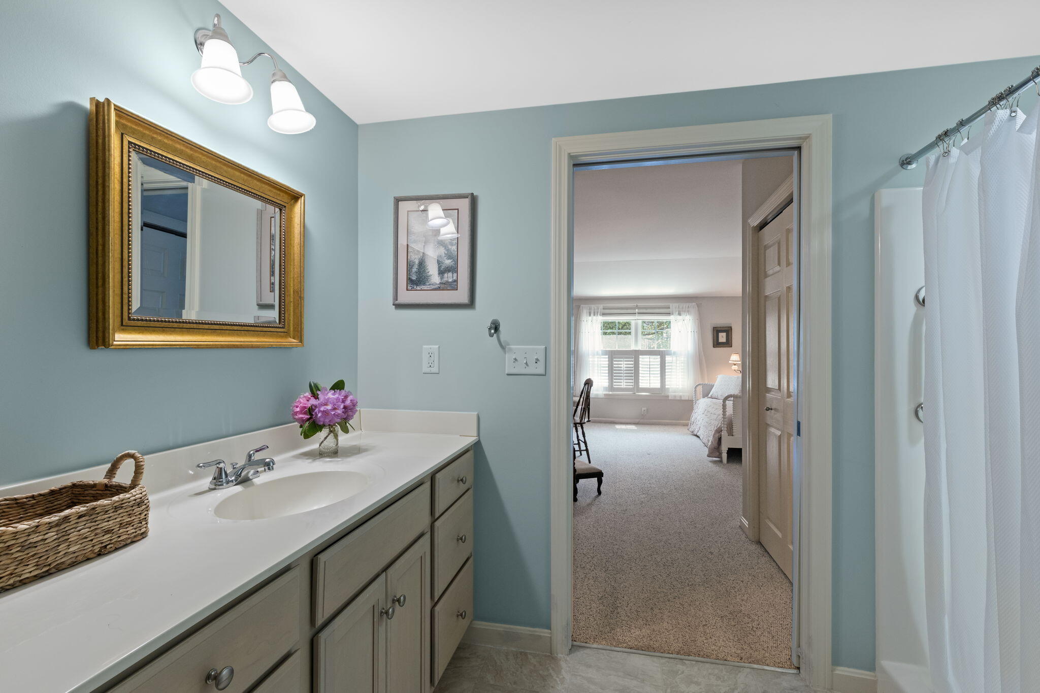 18 West Road, Unit 315 Orleans, MA 02653 - Photo 25 of 49 a en suite bathroom with a sink double vanity and a mirror