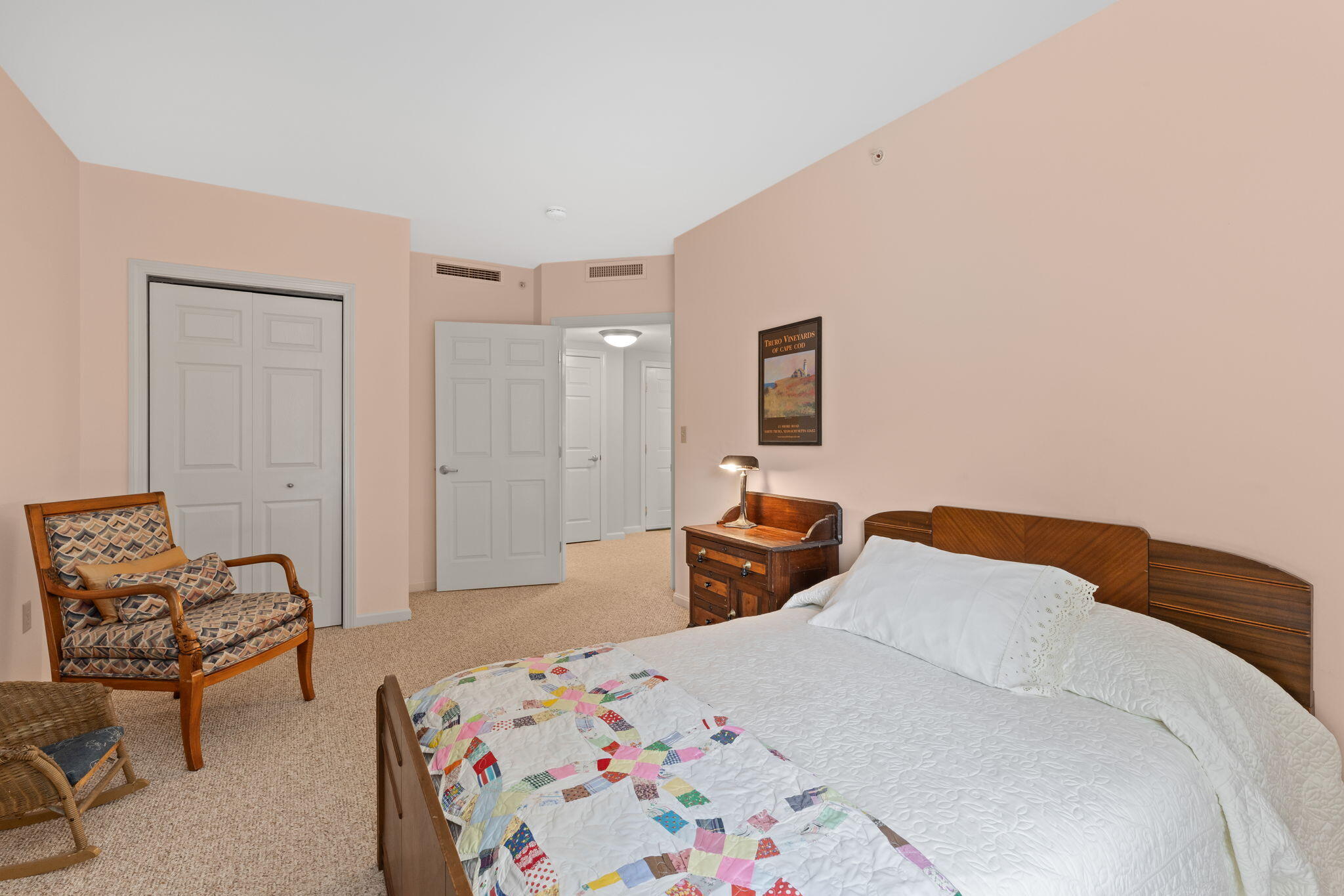 18 West Road, Unit 315 Orleans, MA 02653 - Photo 28 of 49 a bedroom with a bed and a couch