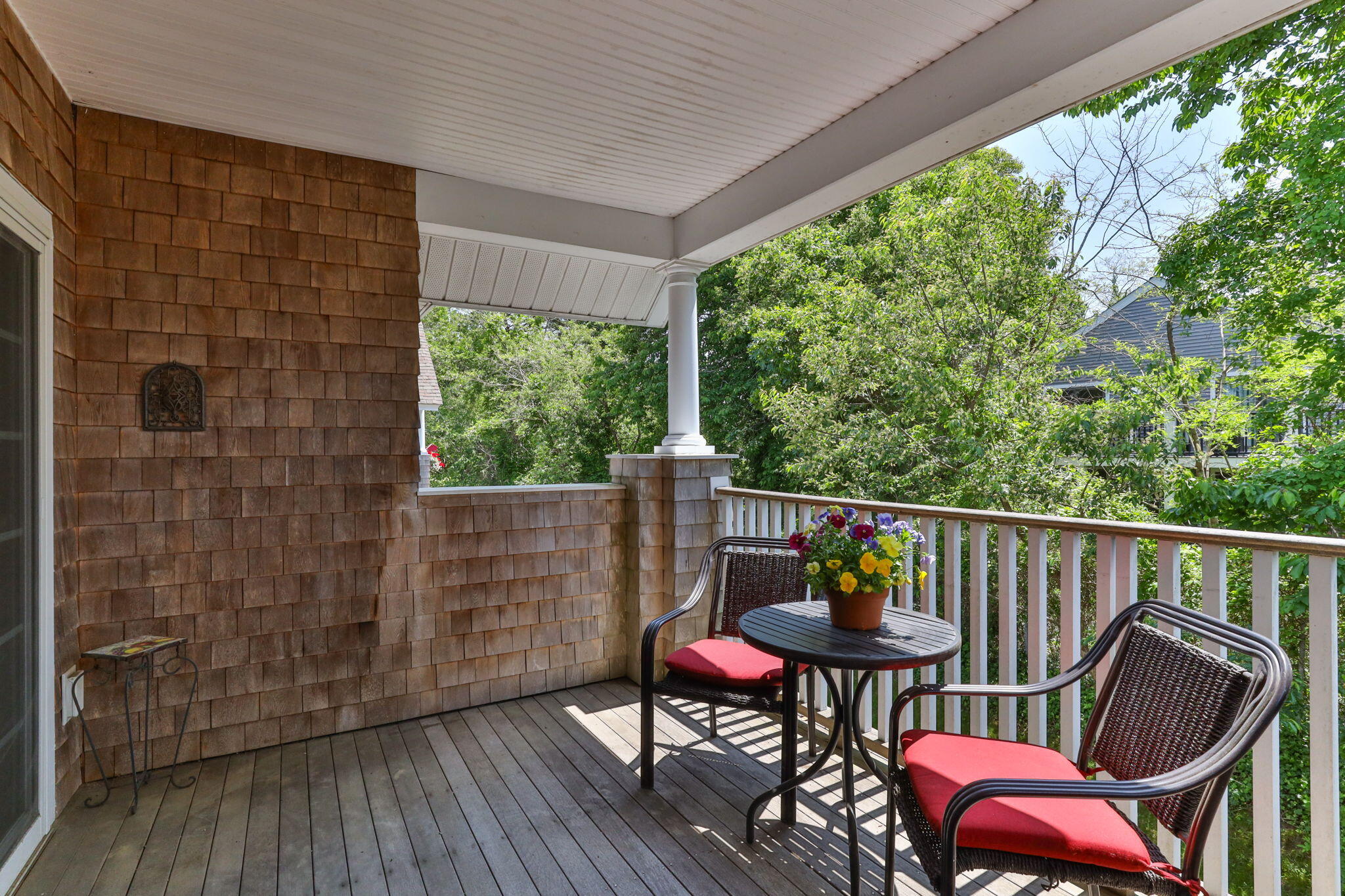 18 West Road, Unit 315 Orleans, MA 02653 - Photo 30 of 49 a view of a balcony with chairs and wooden floor