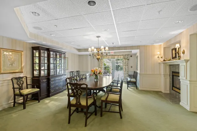 a view of a dining room with furniture and window