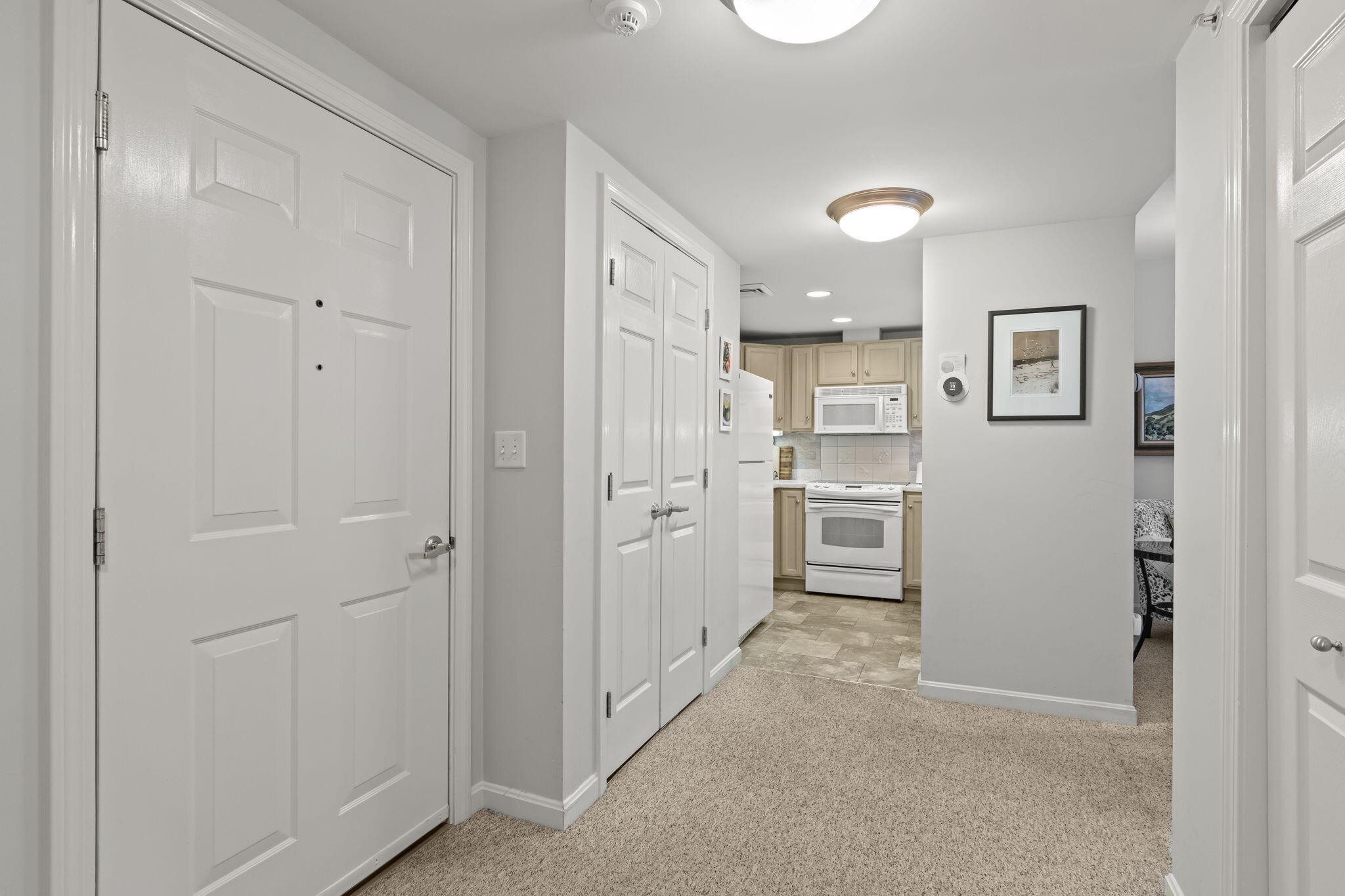 18 West Road, Unit 315 Orleans, MA 02653 - Photo 4 of 49 a view of a kitchen with refrigerator and cabinets