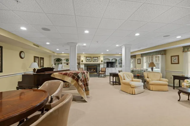 a living room with furniture gym equipment and a flat screen tv