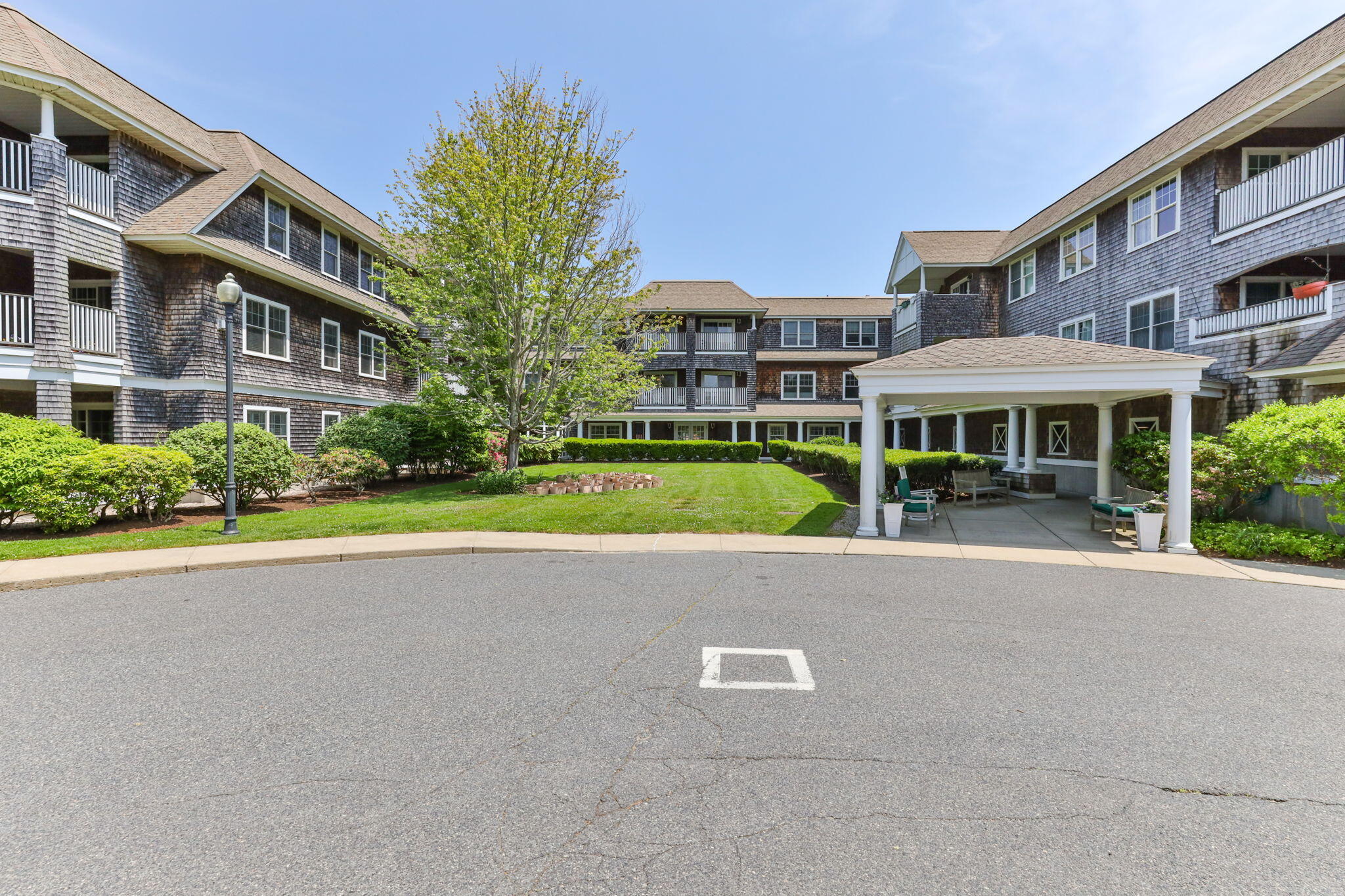 18 West Road, Unit 315 Orleans, MA 02653 - Photo 48 of 49 a view of building with yard