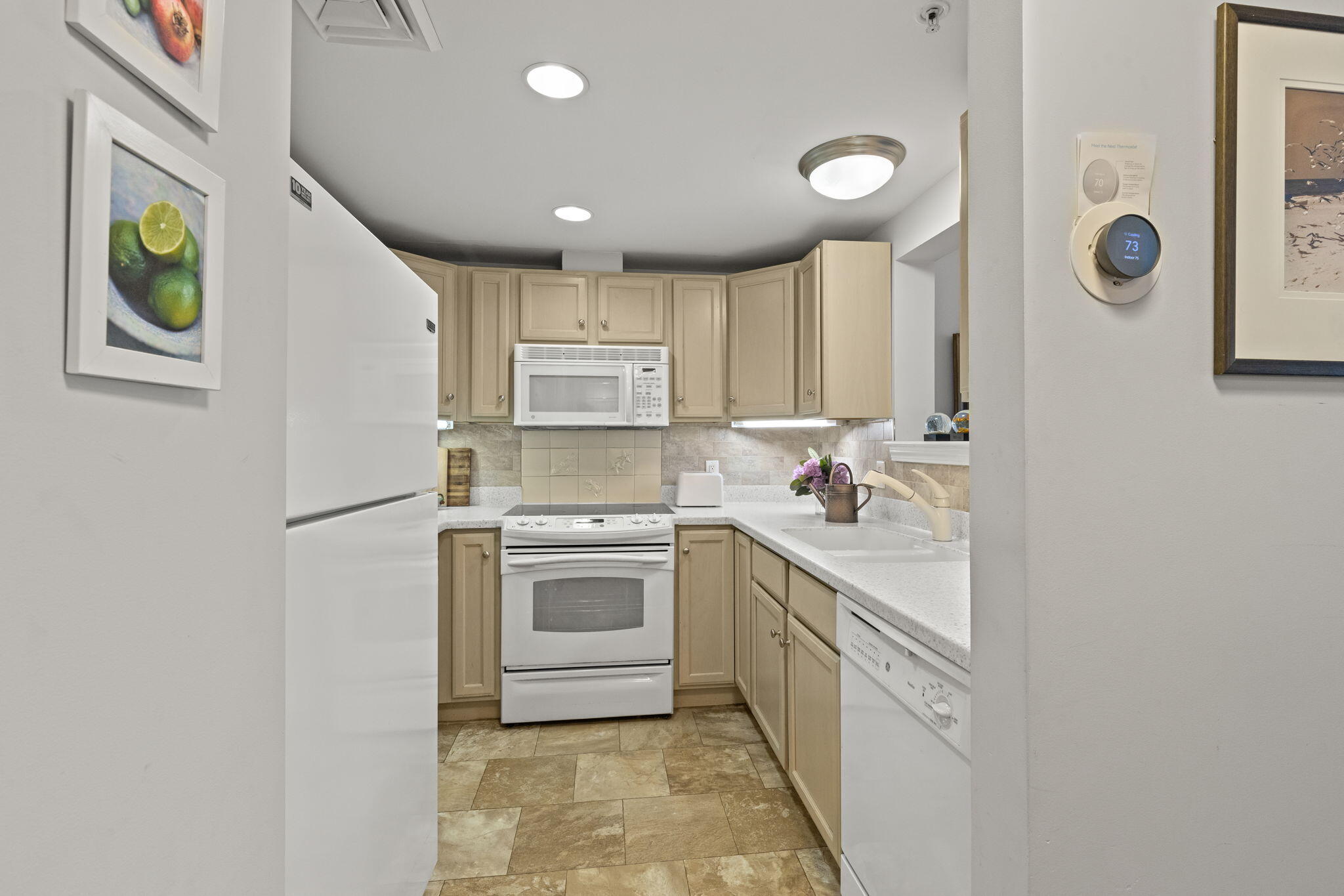 18 West Road, Unit 315 Orleans, MA 02653 - Photo 7 of 49 a kitchen with stainless steel appliances granite countertop a refrigerator and a stove