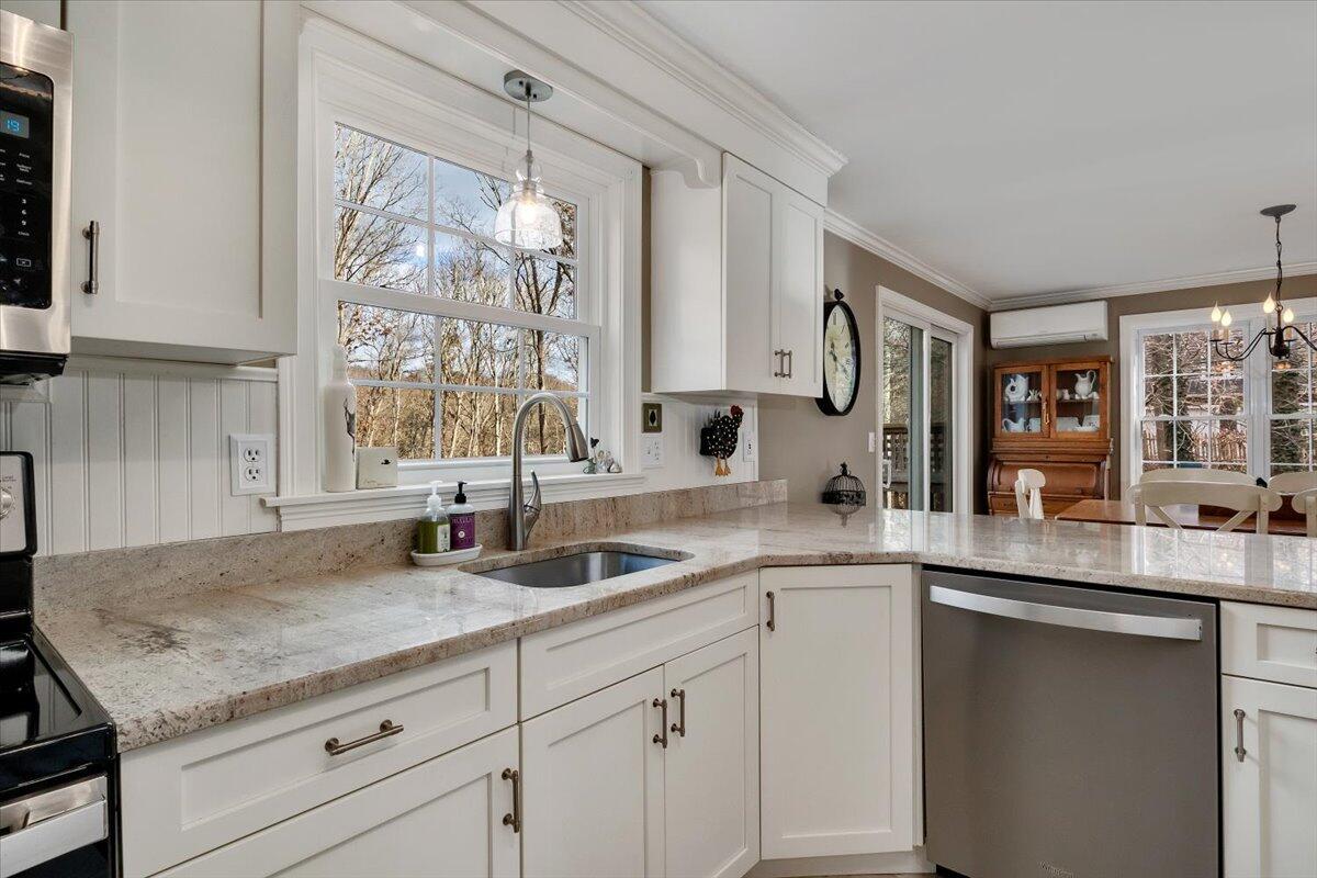 25 Christopher Hollow Road Sandwich, MA 02563 - Photo 16 of 47 a kitchen with granite countertop stainless steel appliances a sink and cabinets