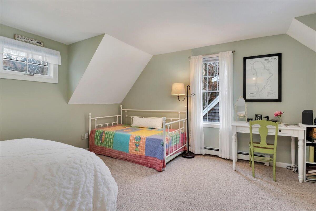 25 Christopher Hollow Road Sandwich, MA 02563 - Photo 29 of 47 a bedroom with a bed and a table in it