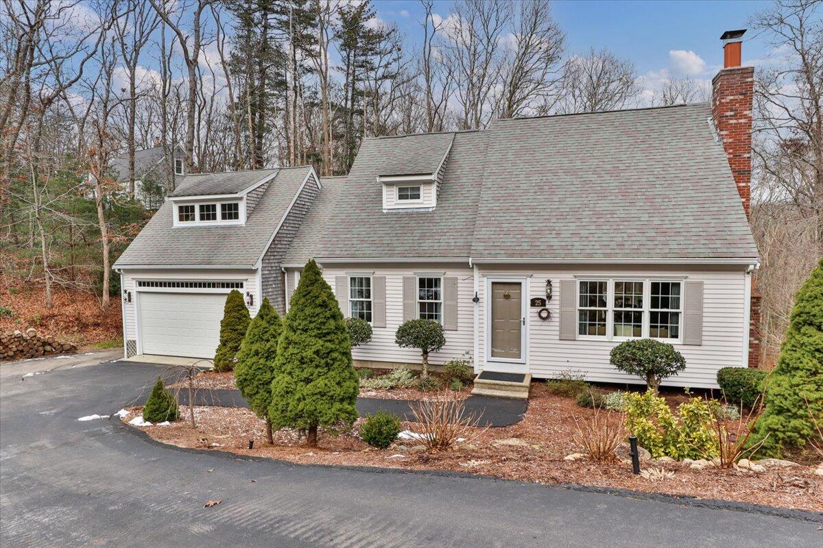 25 Christopher Hollow Road Sandwich, MA 02563 - Photo 3 of 47 a front view of a house with a yard garage and outdoor seating