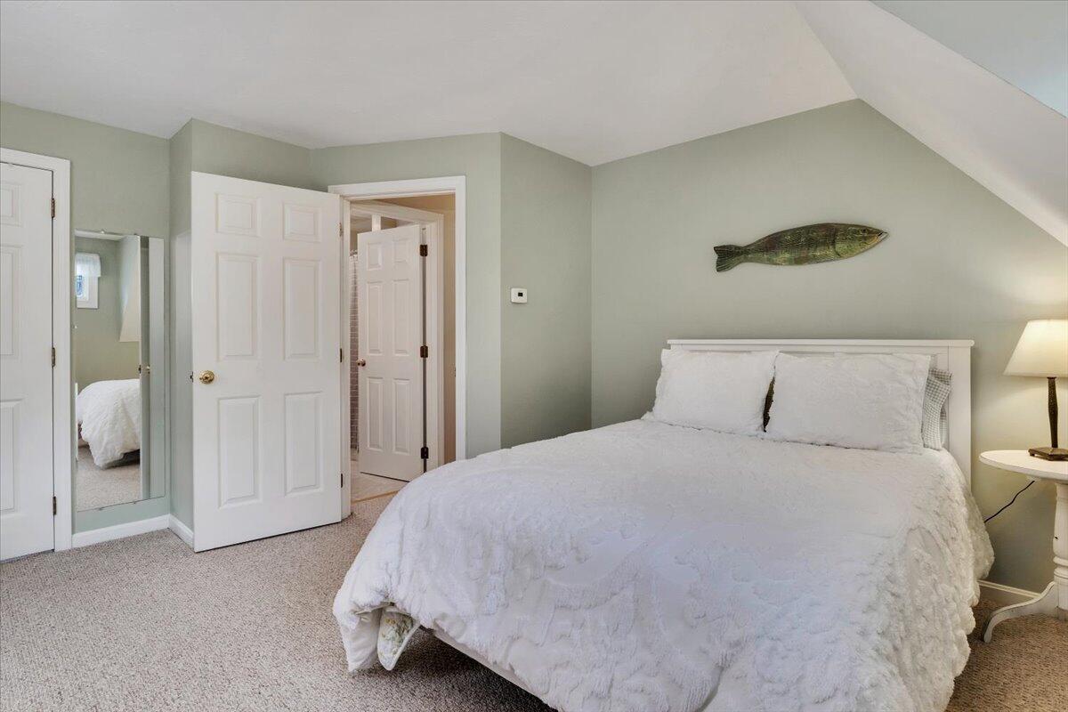 25 Christopher Hollow Road Sandwich, MA 02563 - Photo 31 of 47 a bedroom with a bed and a walk in closet