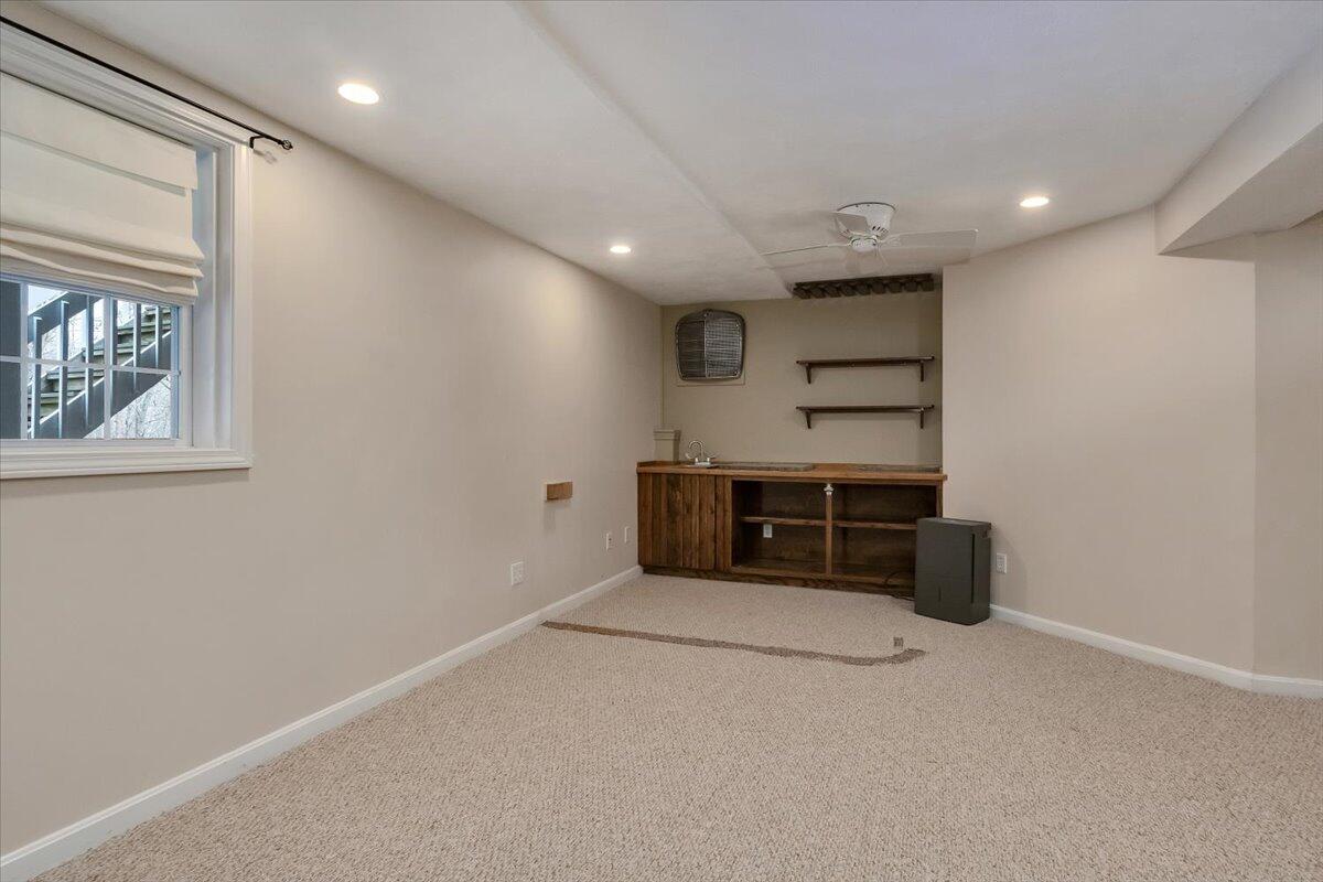 25 Christopher Hollow Road Sandwich, MA 02563 - Photo 33 of 47 a view of an empty room with a fireplace