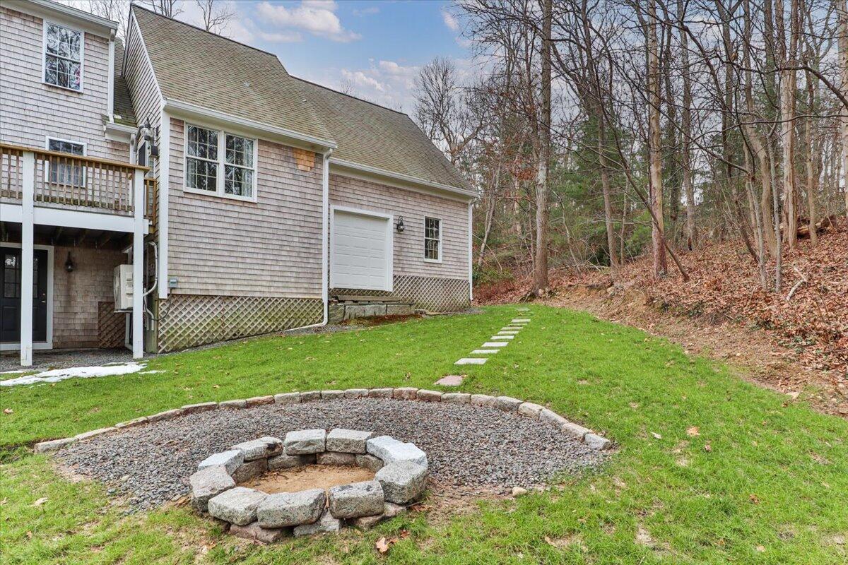 25 Christopher Hollow Road Sandwich, MA 02563 - Photo 40 of 47 a backyard of a house with lots of green space