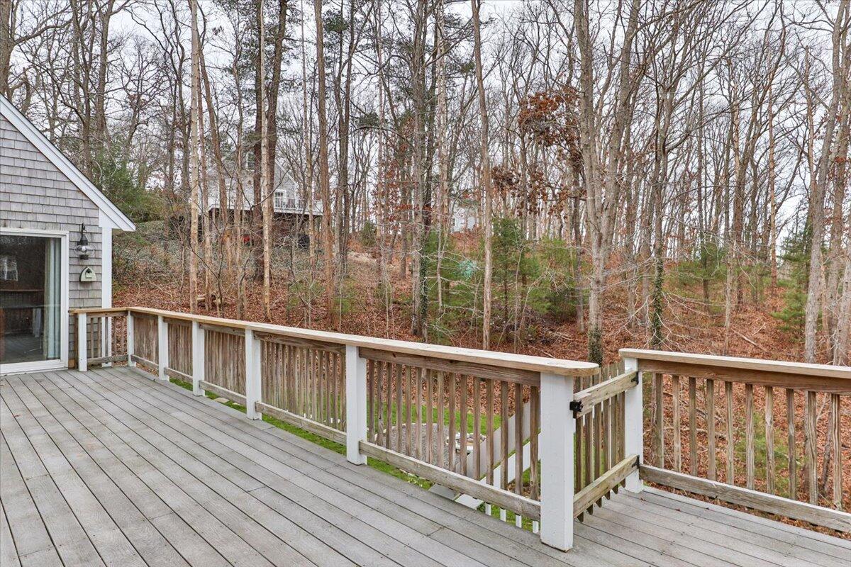 25 Christopher Hollow Road Sandwich, MA 02563 - Photo 43 of 47 a view of a roof deck with wooden floor and fence