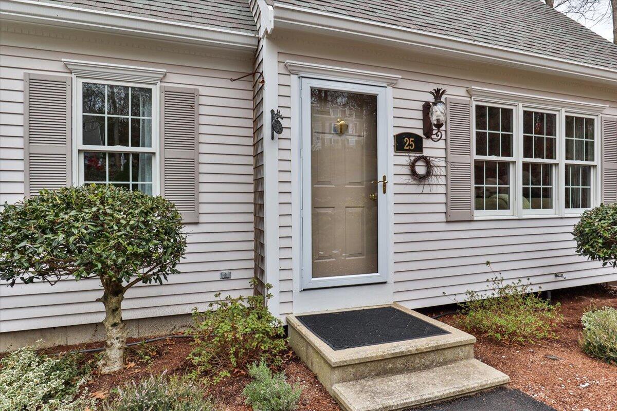 25 Christopher Hollow Road Sandwich, MA 02563 - Photo 5 of 47 a front view of a house with a yard