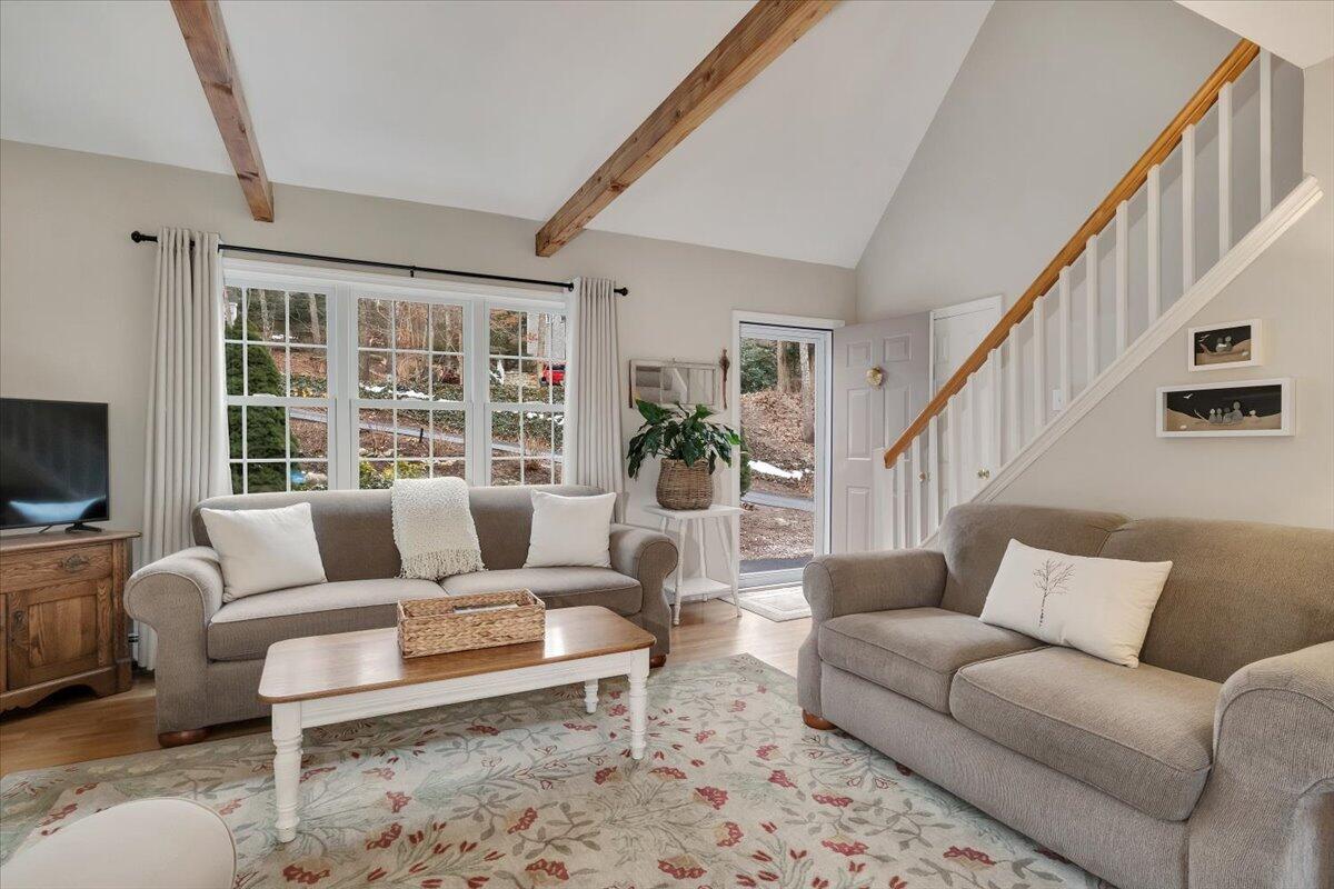 25 Christopher Hollow Road Sandwich, MA 02563 - Photo 8 of 47 a living room with furniture a rug and a flat screen tv