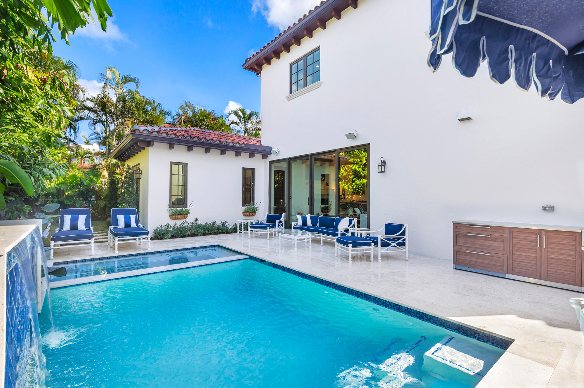 265 Marlborough Road West Palm Beach, FL 33405 - Photo 17 of 77 a view of a house with swimming pool and sitting area