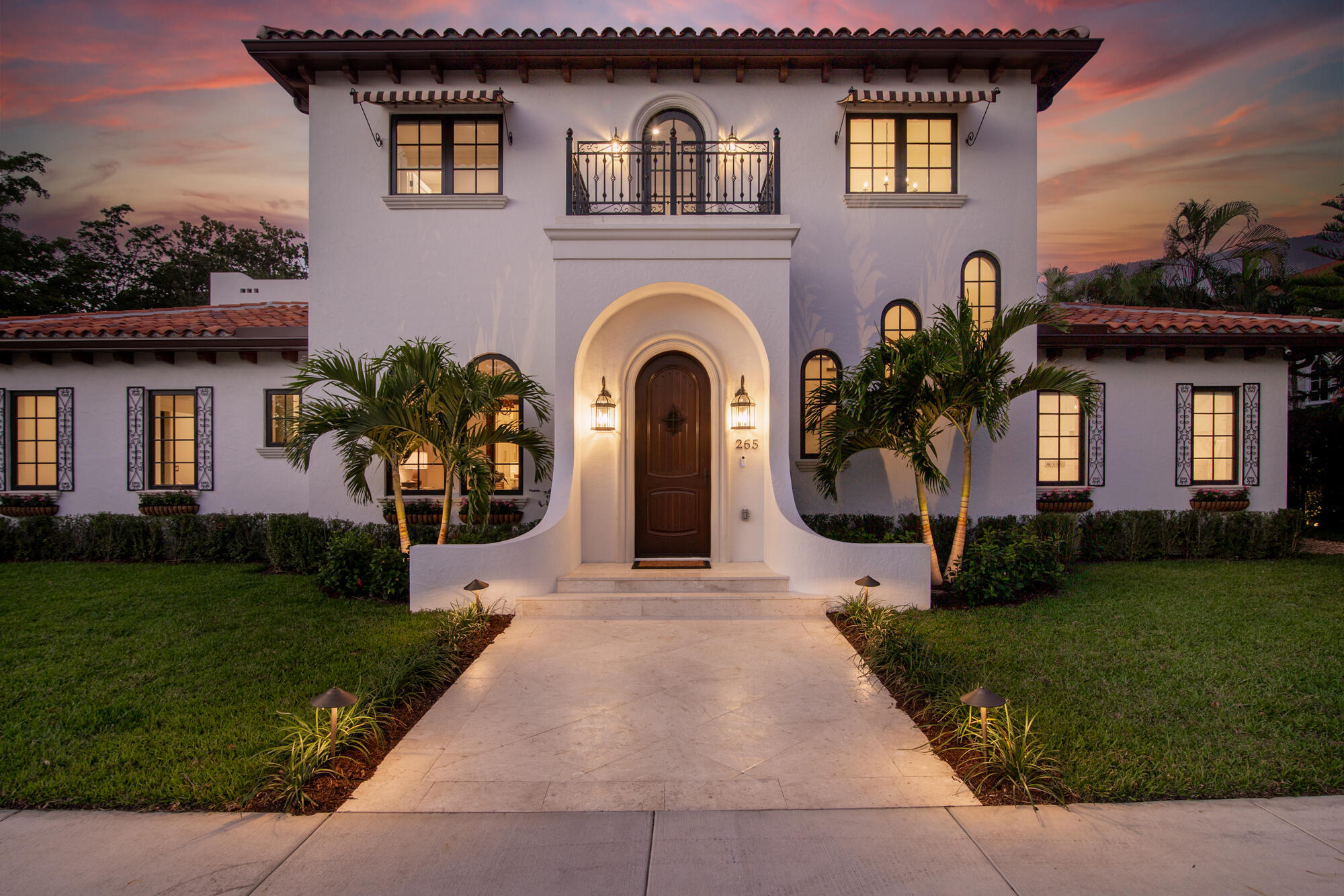 265 Marlborough Road West Palm Beach, FL 33405 - Photo 3 of 77 a front view of a house with a garden