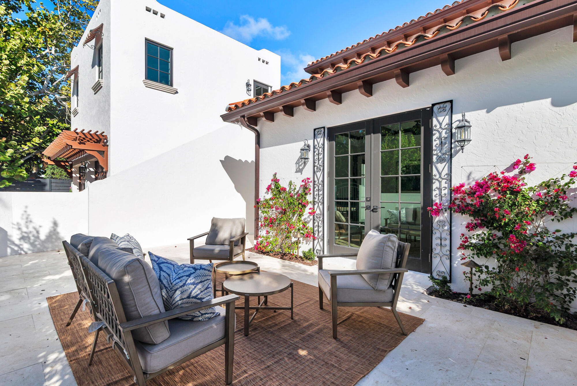 265 Marlborough Road West Palm Beach, FL 33405 - Photo 34 of 77 a view of a patio with a table and chairs and potted plants