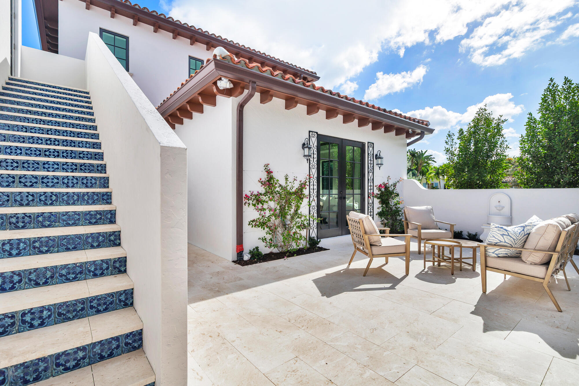 265 Marlborough Road West Palm Beach, FL 33405 - Photo 35 of 77 a view of a patio with table and chairs and potted plants