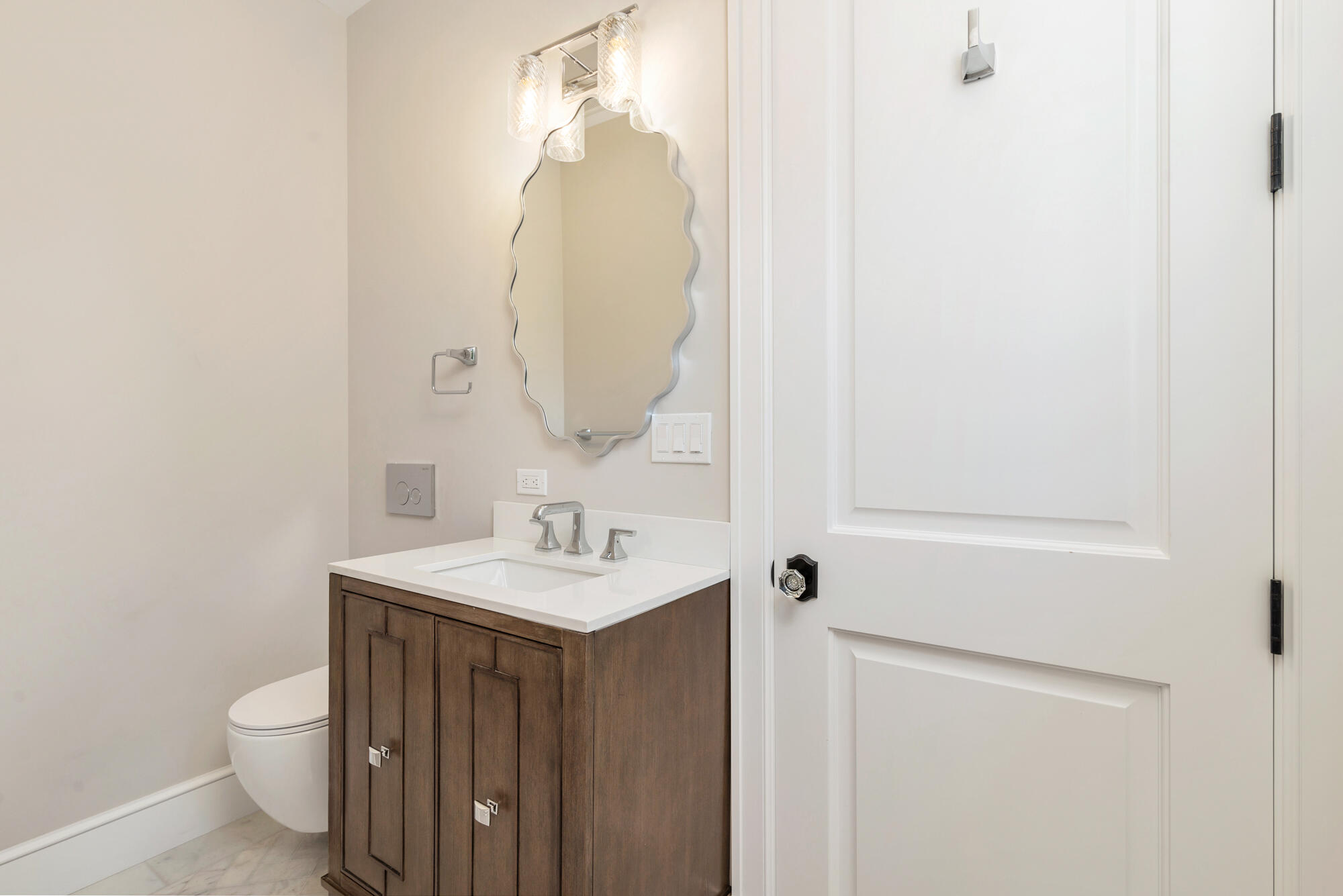 265 Marlborough Road West Palm Beach, FL 33405 - Photo 49 of 77 a bathroom with a sink a toilet and a mirror