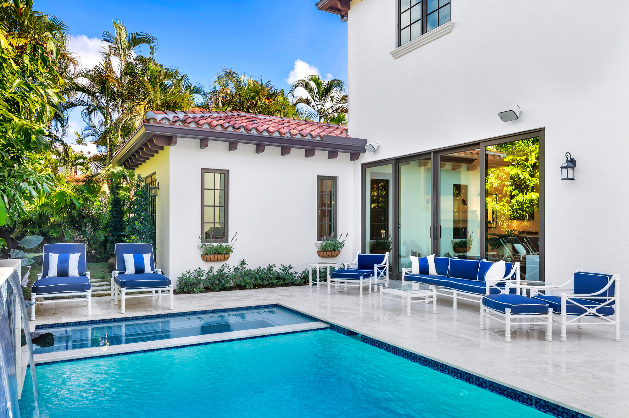 265 Marlborough Road West Palm Beach, FL 33405 - Photo 64 of 77 a view of a patio with table and chairs potted plants and large tree