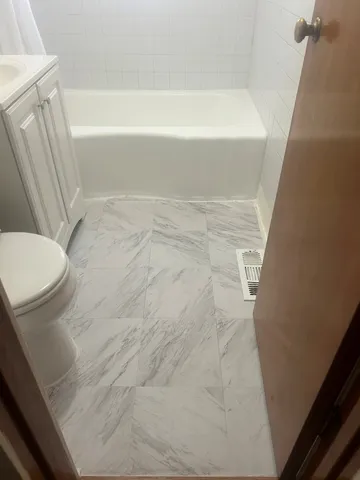 a bathroom with a sink and a toilet