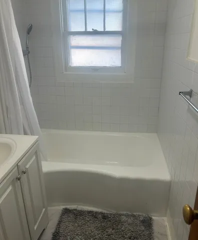 a close up of a bathtub in a bathroom