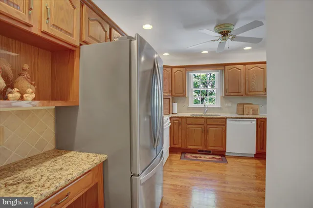 a view of storage and utility room with two washing machine